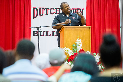 Coach Kevin Jones (center) speaks during the memorial service for Wali Clanton Jr. at Dutchtown High School in Hampton on Thursday, June 18, 2015. 