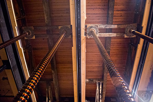 Giant screws are used to raise and lower the stage pit floor at the Fox Theatre in Atlanta on Monday, June 22, 2015.