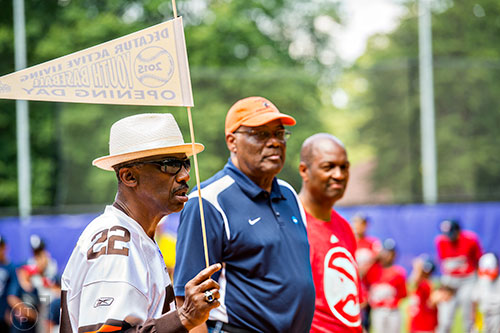 Clarence Scott (left), Harry Flourny and Mike Glenn, all former pro athletes, participate in the ceremony for the opening day of Decatur Youth Baseball at Oakhurst Park on Saturday, June 6, 2015.
