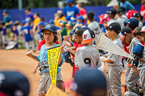 Players gear up for their games as the ceremony for the opening day of Decatur Youth Baseball comes to a close at Oakhurst Park on Saturday, June 6, 2015.