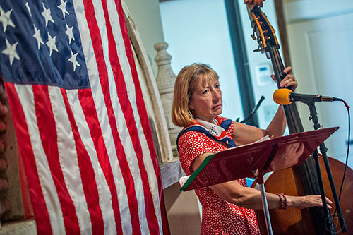 Kim Fair with the band SmokeRise performs during the inaugural BBQ & Bluegrass at Barrington Hall in Roswell on Saturday, July 4, 2015. 