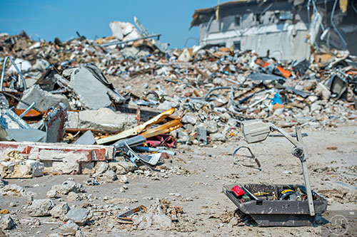 An old projector machine lays broken next to piles of debris at the GM Plant in Doraville on Monday, June 29, 2015.