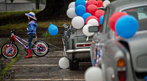Sofie Plishka lines up to ride her bike in the Avondale Estates 4th of July Parade on Saturday. 