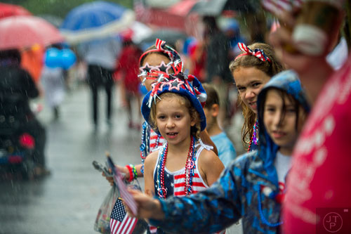 Rain doesn't stop people from coming out to watch the Avondale Estates 4th of July Parade on Saturday. 