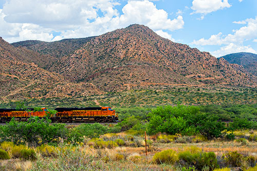 Racing a train as it moves along the tracks beside Route 66 in Arizona on Friday, July 17, 2015.