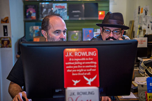Frank Reiss (left) and Chris Buxbaum prepare for the arrival of author Jesse Goolsby at A Cappella bookstore in Atlanta on Monday, June 29, 2015. Reiss is the owner of the independent book store that has been an Atlanta staple for decades. 
