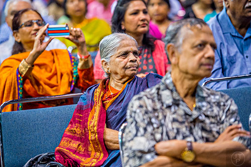 Samrajyamma Rachakulla (center) watches the performances on stage during the Festival of India at the Gwinnett Center in Duluth on Saturday, August 22, 2015. 