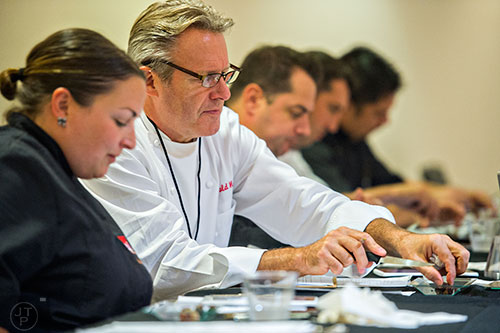 World renowned pastry chef Ewald Notter (center) judges the Chocolatier of the Year competition during Pastry Live 5 at 200 Peachtree in Atlanta on Sunday, August 23, 2015. 