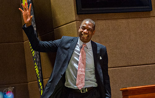 Dikembe Mutombo waves to the crowd during the celebration naming September 1 as Dikembe Mutombo Day in Fulton County at the Fulton County Government Center in Atlanta on Tuesday, September 1, 2015.   JONATHAN PHILLIPS / SPECIAL