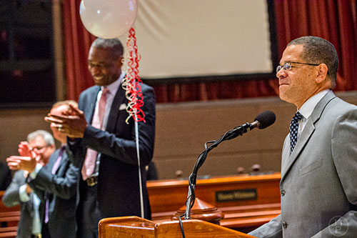 Fulton County Chairman John H. Eaves (right) speaks during the celebration naming September 1 as Dikembe Mutombo Day in Fulton County at the Fulton County Government Center in Atlanta on Tuesday, September 1, 2015.   