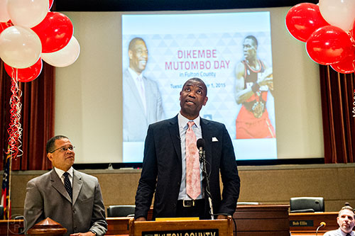 Dikembe Mutombo (center) speaks during the celebration naming September 1 as Dikembe Mutombo Day in Fulton County at the Fulton County Government Center in Atlanta on Tuesday, September 1, 2015.   