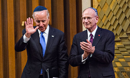 Vice President of the United States Joe Biden (left) waves to the crowd as he stands next to Stuart Eizenstat during the 2015 Fran Eizenstat and Eizenstat Family Annual Lecture at the Ahavath Achim Synagogue in Atlanta on Thursday, September 3, 2015.   