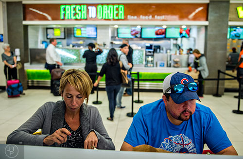 Hillary Mantel (left) and her husband James eat at the Terminal B food court inside the Hartsfield Jackson Atlanta International Airport on Wednesday, September 2, 2015. 
