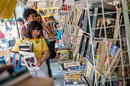 Jean Tomlinson looks for books to buy during the AJC Decatur Book Festival on Saturday, September 5, 2015. 
