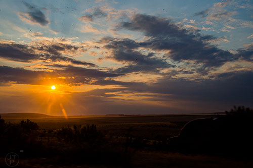 The sun sets over the border between Washington state and Oregon on Monday, August 3, 2015.