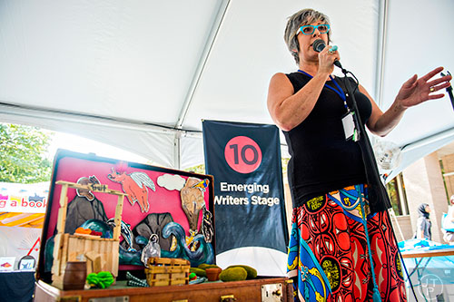 Author Leisa Rich speaks to the crowd while on the Emerging Writers Stage during the Decatur Book Festival on Saturday.