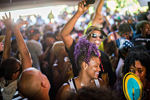 Renee J. Ross (center) dances amidst the throngs of people during House at the Park at Grant Park in Atlanta on Sunday, September 6, 2015.
