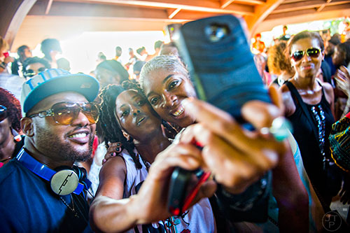 Norris McCrutcheon (left), Inglish Alford and Iris Hopgood take a selfie as they dance during House at the Park at Grant Park in Atlanta on Sunday, September 6, 2015.