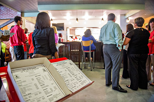 Standing in line to order take out at the newly opened Gus's World Famous Fried Chicken inside the Mall at Peachtree Center in Atlanta on Thursday, August 20, 2015.