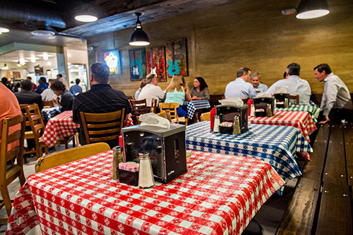 Inside the dining area at the newly opened Gus's World Famous Fried Chicken inside the Mall at Peachtree Center in Atlanta on Thursday, August 20, 2015.