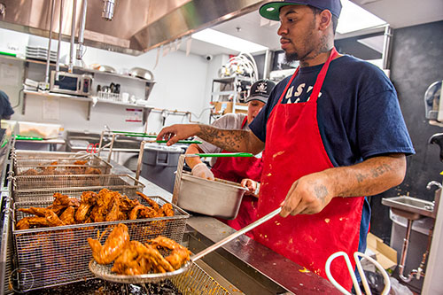Inside the kitchen at the newly opened Gus's World Famous Fried Chicken inside the Mall at Peachtree Center in Atlanta on Thursday, August 20, 2015.