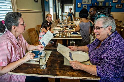 Elizabeth Eakes (left) and Linda Rosen look over the menu at Revival in Decatur.