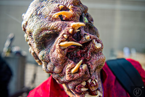 Dressed as a Netherworld mutant, April McKaig waits in the marshalling yard for the start of the annual DragonCon Parade in Atlanta on Saturday, September 5, 2015.  