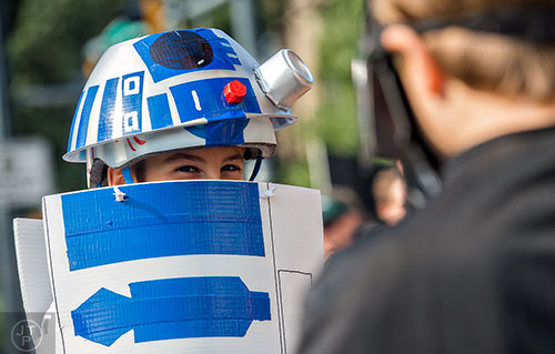 Dressed as R2-D2, Max Pigott waits for the annual DragonCon Parade to start in Atlanta on Saturday, September 5, 2015.   