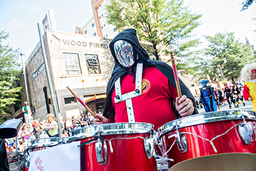 Ryan Dahlgren plays the quads as he marches down Peachtree St. with the Seed & Feed Marching Abominable during the annual DragonCon Parade in Atlanta on Saturday, September 5, 2015.   