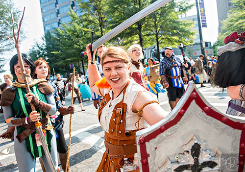 Ready for battle, Teddi Schwartze marches down Peachtree St. during the annual DragonCon Parade in Atlanta on Saturday, September 5, 2015.   