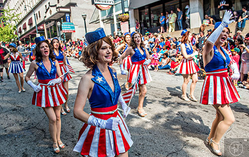 Kathy Skirmont (center) and the rest of the Captain America Dancing Girls march in the annual DragonCon Parade in Atlanta on Saturday, September 5, 2015.  