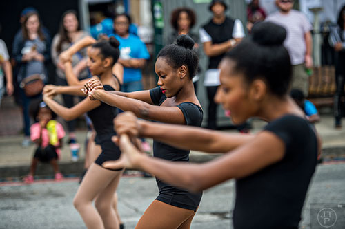 Akilah Williams (center) performs at the main stage during the 5 Arts Fest in the Little Five Points neighborhood of Atlanta on Saturday, September 12, 2015. 