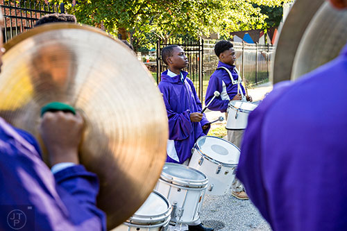 Demitrius Clark (center) and Nicholas King perform with the Kipp Schools drumline before the start of the Families First groundbreaking ceremony at the historic E.R. Carter Elementary School in Atlanta on Thursday, September 17, 2015.  