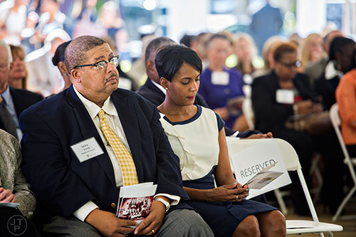 Atlanta City Council members Ivory Young (left) and Keisha Lance-Bottoms listen during the Families First groundbreaking ceremony at the historic E.R. Carter Elementary School in Atlanta on Thursday, September 17, 2015.  