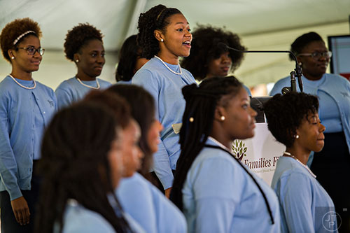 Jaleesa Schoolfield (center) and the Spelman College Glee Club perform during the Families First groundbreaking ceremony at the historic E.R. Carter Elementary School in Atlanta on Thursday, September 17, 2015.  