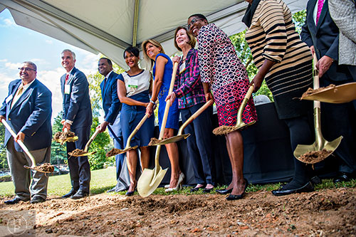 Families First CEO Kim Anderson (right), Lucy Vance, Julie Salisbury, Keisha Lance-Bottoms, Atlanta Mayor Kasim Reed, Ivory Young (left) and other dignitaries break ground on the new Families First Resource Center at the historic E.R. Carter Elementary School in Atlanta on Thursday, September 17, 2015.  
