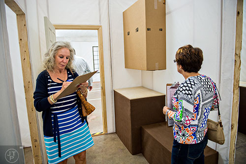 Mary Schechter (left) makes notes as she participates in a focus group at the Pulte Group's Innovation Center in Norcross on Monday, September 14, 2015. 
