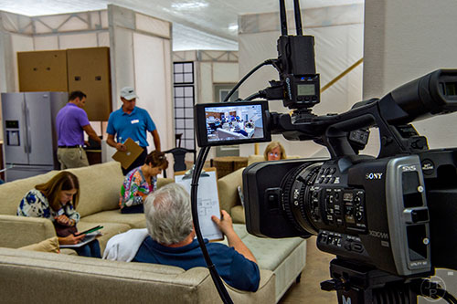A video camera stands in the corner recording participant responses during a focus group at the Pulte Group's Innovation Center in Norcross on Monday, September 14, 2015. 