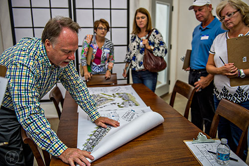 Ray Hitt (left) explains a possible layout for a housing development to a focus group at the Pulte Group's Innovation Center in Norcross on Monday, September 14, 2015. 