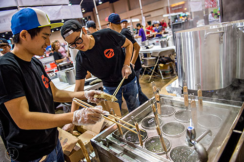 September 19. 2015 Duluth - Kun Hyuk Lee (left) and Hyun Jun Wang cook noodles during JapanFest at the Infinite Energy Center in Duluth on Saturday, September 19, 2015.  