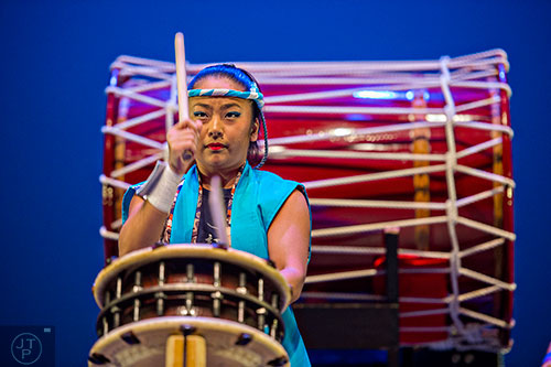Sayaka Kikuchi beats her taiko drum as she performs on stage during JapanFest at the Infinite Energy Center in Duluth on Saturday, September 19, 2015.  