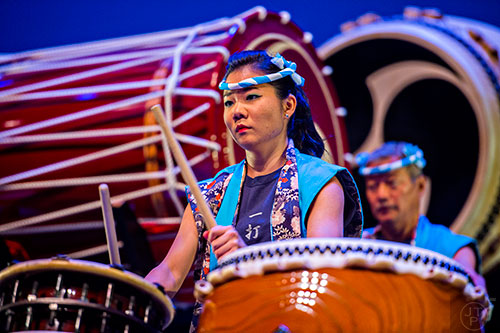 Keiko Ishikura beats her taiko drum as she performs on stage with her father Takemasa during JapanFest at the Infinite Energy Center in Duluth on Saturday, September 19, 2015. 