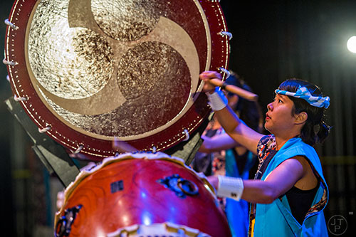 Mayuko Ishikura beats her taiko drum as she performs on stage during JapanFest at the Infinite Energy Center in Duluth on Saturday, September 19, 2015.  