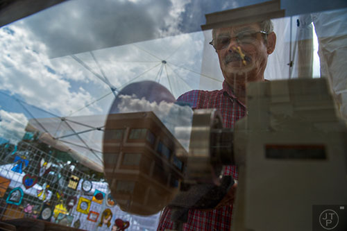 Richard Losey makes a sycamore tray during the Marietta StreetFest in the historic downtown square on Saturday, September 19, 2015. 