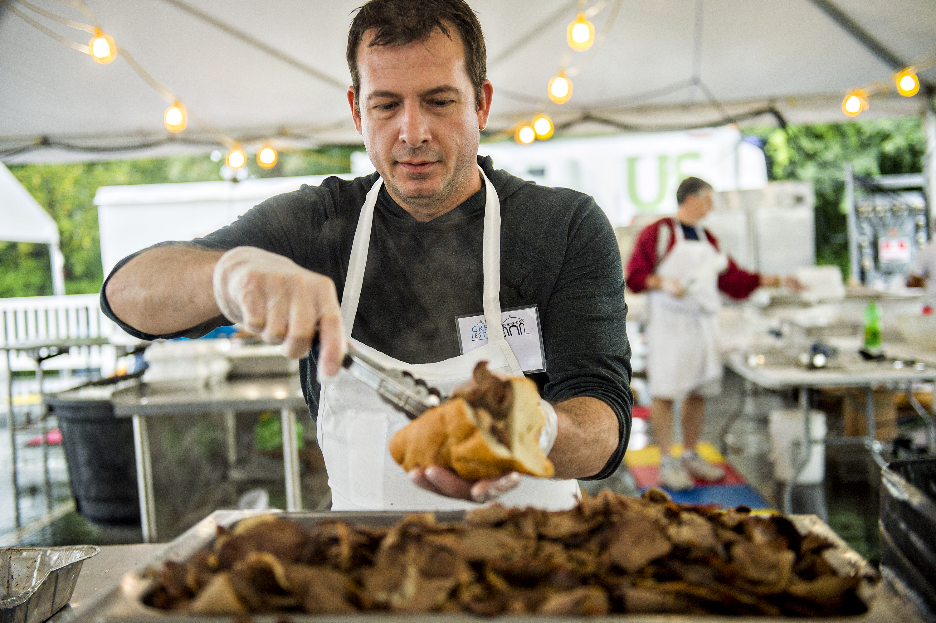 Roger Wycoff prepares lamb sandwiches during the Atlanta Greek Festival at the Greek Orthodox Cathedral of Annunciation on Saturday, September 26, 2015. 