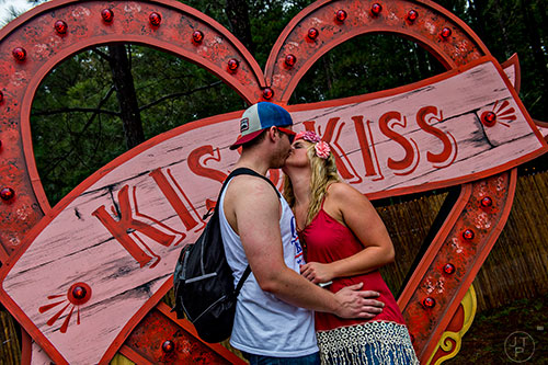 D.J. St. Pierre (left) kisses Andi Flannery during TomorrowWorld in Chattahoochee Hills on Saturday, September 26, 2015. 