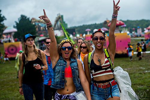 Alix Kaiser (left) walks with Rika Thibodeaux as they make their way to their next stage during TomorrowWorld in Chattahoochee Hills on Saturday, September 26, 2015. 
