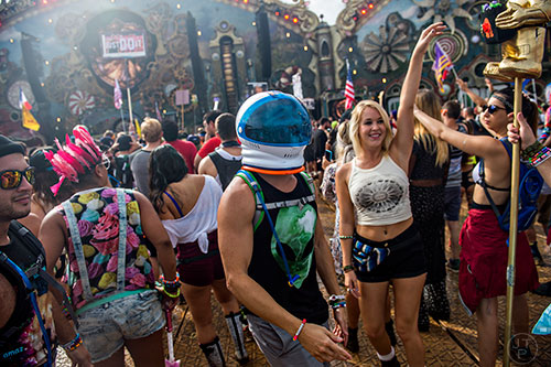 Nick Smart (center) and Ania Chee dance during TomorrowWorld in Chattahoochee Hills on Saturday, September 26, 2015. 
