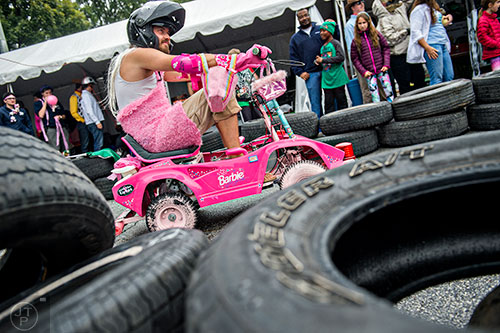 Russell Fair rides in a small vehicle in the Moxie Challenge during the Atlanta Maker Faire in Decatur on Saturday, October 3, 2015. 