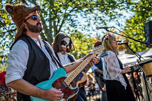 Jerry Tew (left) plays the bass with the Rumours before the start of the Little Five Points Halloween Parade in Atlanta on Saturday, October 17, 2015. 